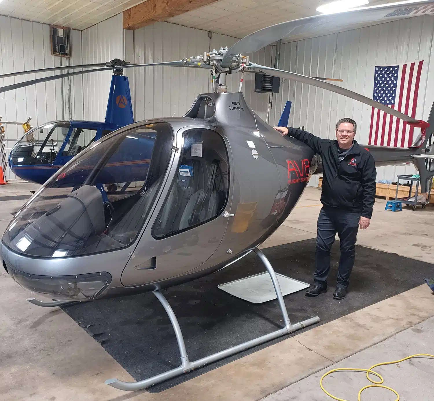 George Lichty with AV8 Helicopter, AV8 Flight School, Eden Prairie MN